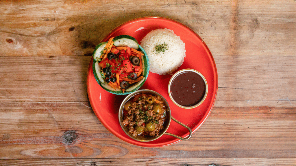 Picadillo with rice beans and ensalada